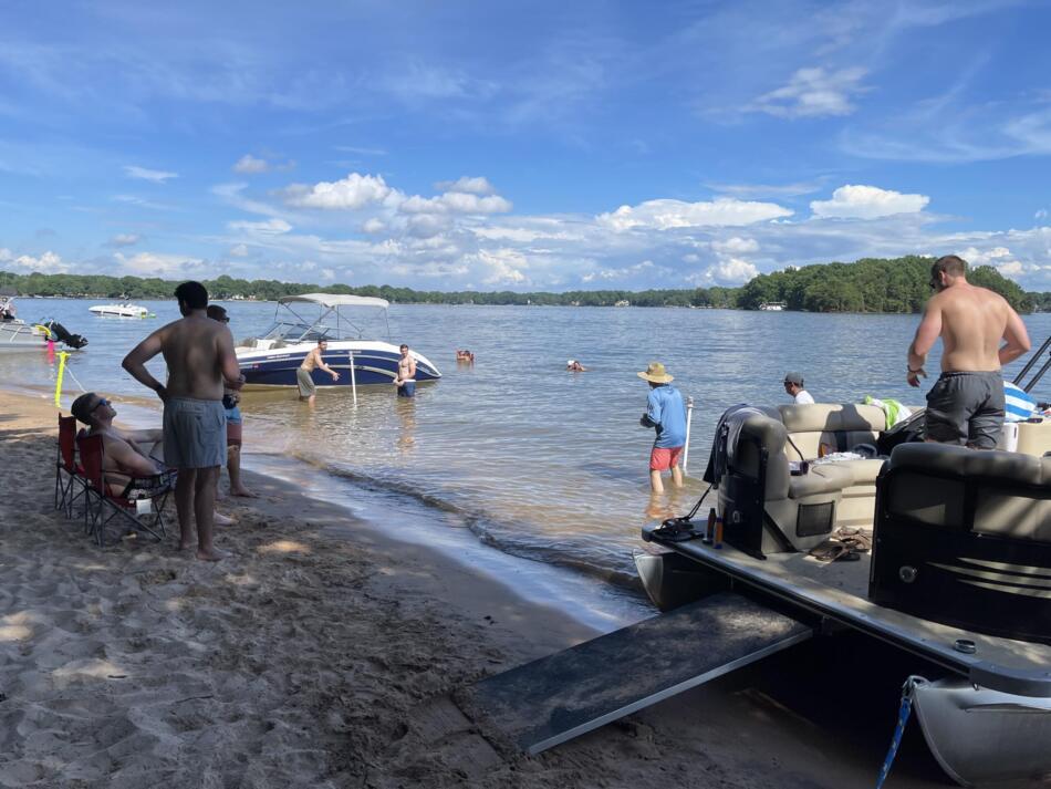 Playing Beersbee at the sandbar with Party Pontoon boat rentals.